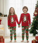 Crianças de mãos dadas com pijamas de Natal - corrigida